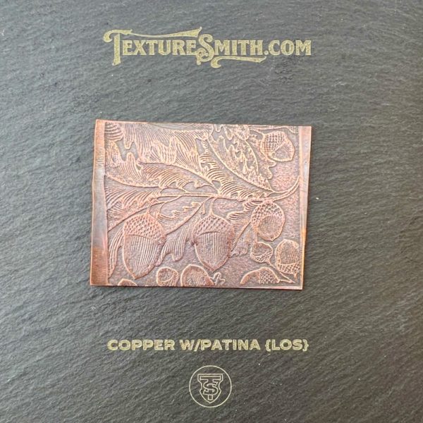 Copper plate with leaf pattern design.