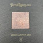 Copper sheet with intricate engraved pattern.