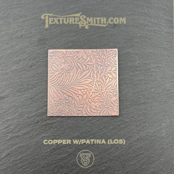 Copper sheet with intricate engraved pattern.