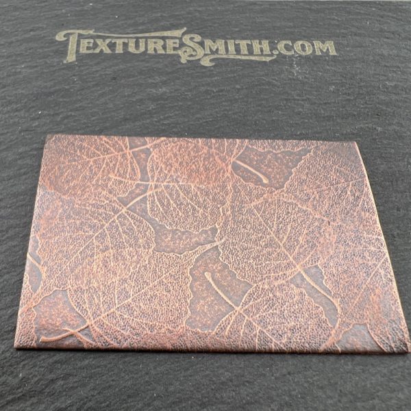 Textured card on black surface with text.