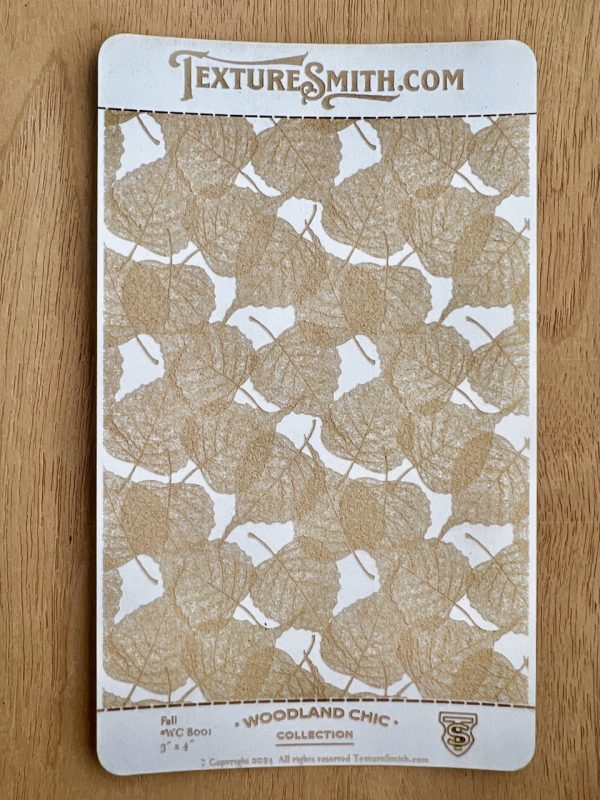 Textured leaf pattern sample on card.