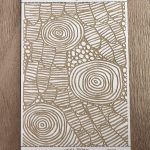 Abstract botanical pattern on textured card.