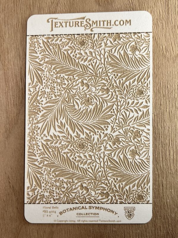 Botanical embossed card on wooden surface.