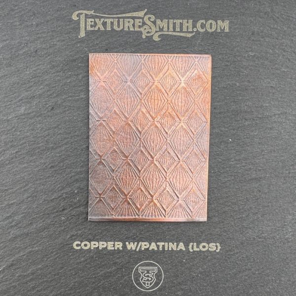 Copper sheet with geometric pattern and patina.