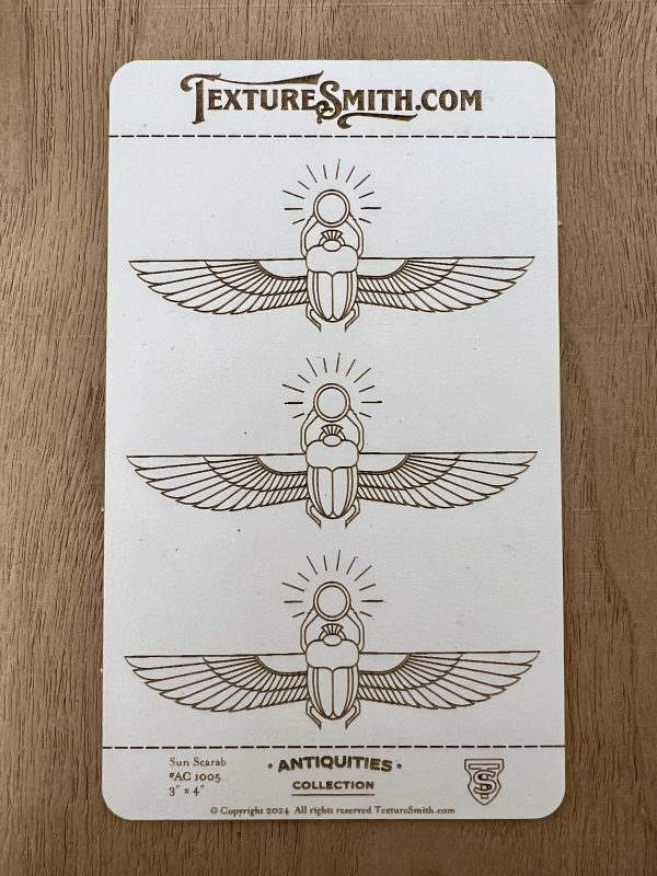 Three scarab beetles with wings design.