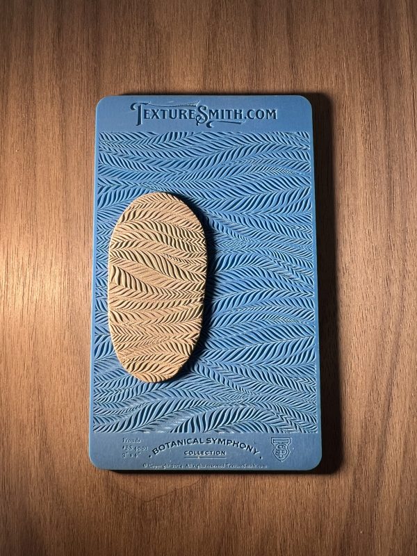 Textured leaf pattern on blue background.