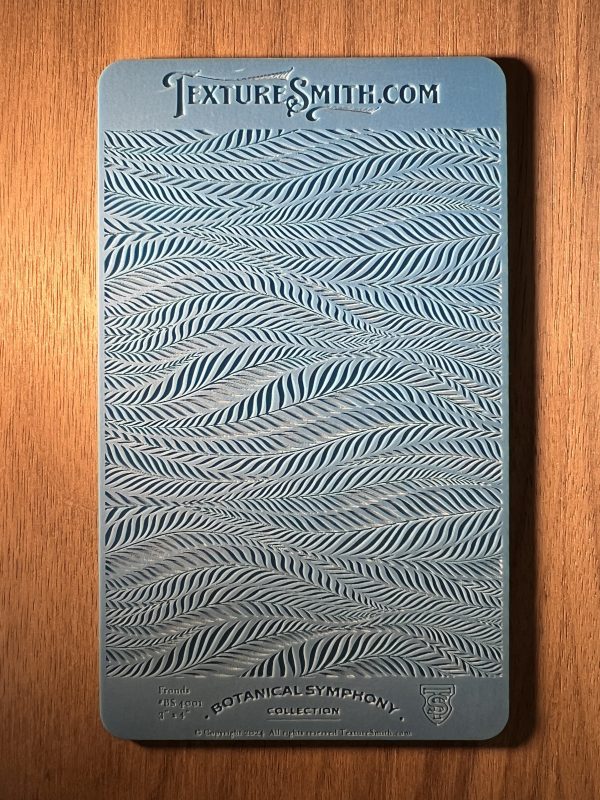 Embossed blue texture sample on wood surface.