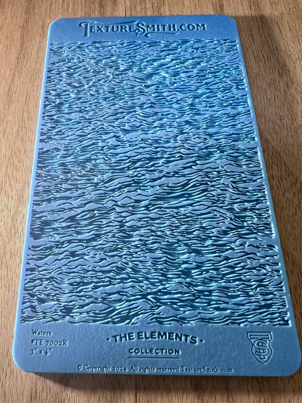 Blue textured surface with wavy water pattern.