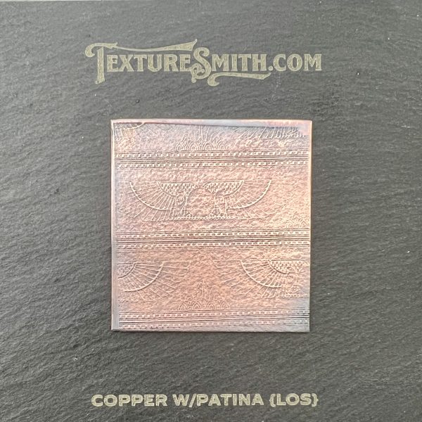 Copper texture sample with intricate patina design.