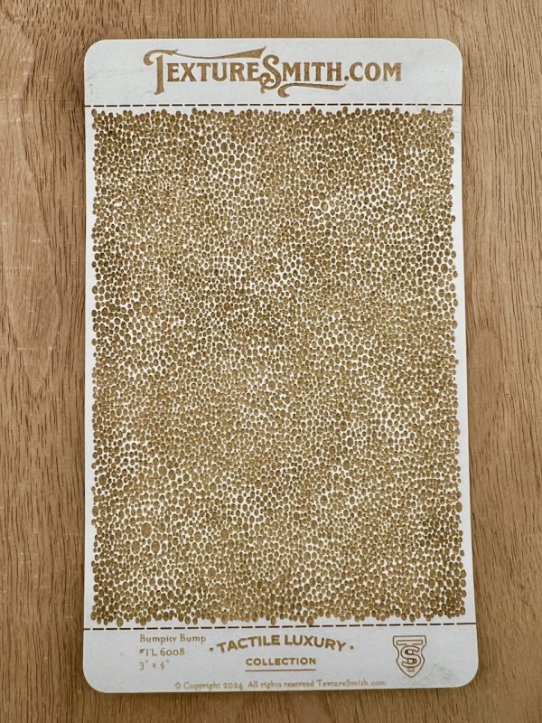 Textured card with brown bumpy pattern.