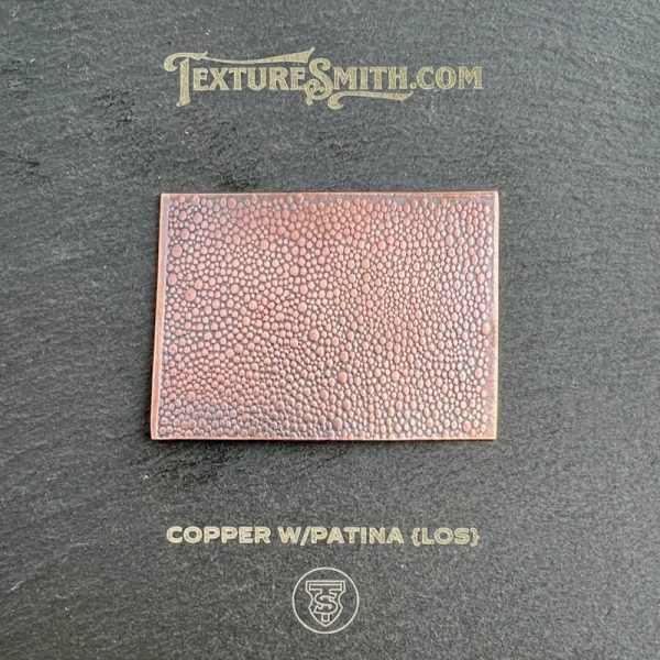 Copper texture sample with patina effect.