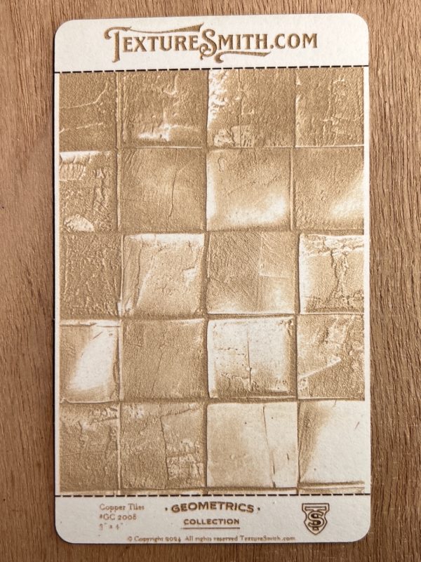 Textured geometric pattern on wooden surface card.