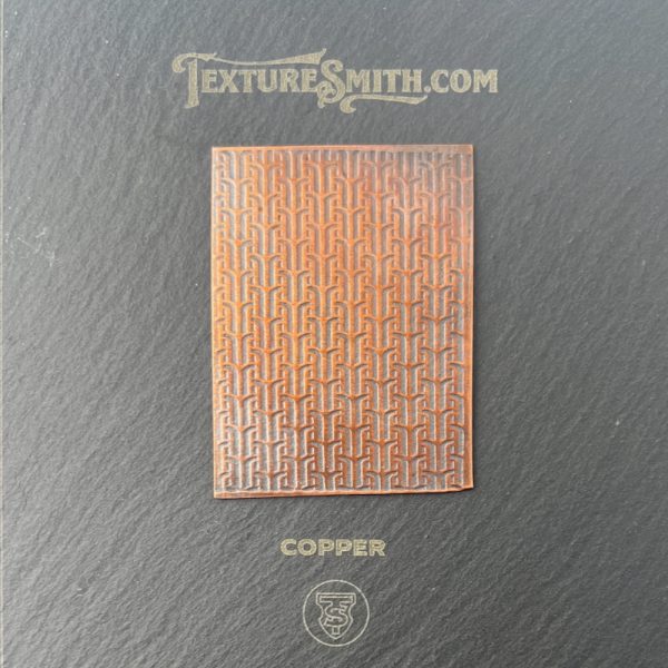 Copper texture sample on black background.
