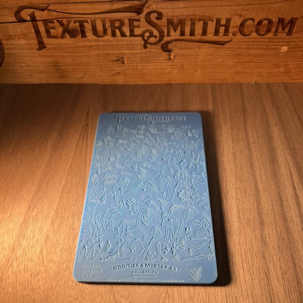 Blue card with abstract patterns on wood.