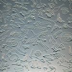 Embossed metal with intricate animal designs.