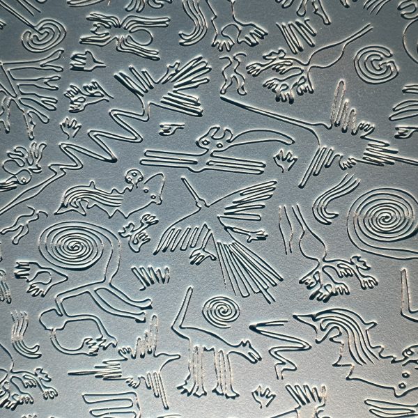 Embossed metal with intricate animal designs.