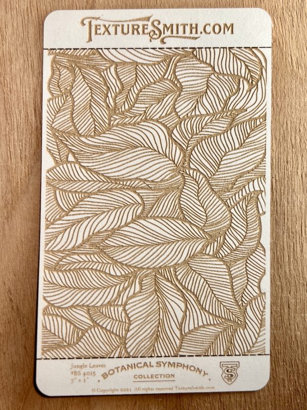 Intricate leaf pattern on textured card.