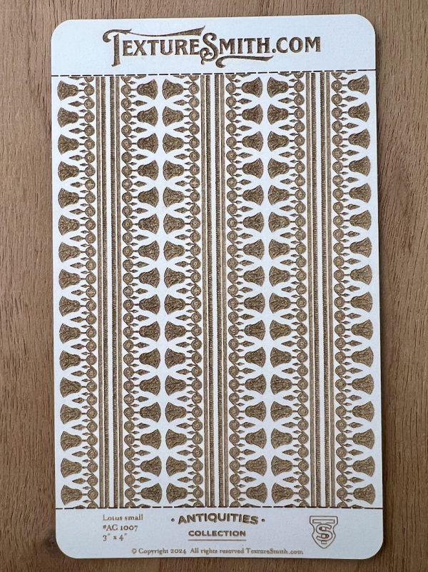 Antique-style textured stencil on wood background.