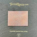 Copper sheet with textured patina finish.