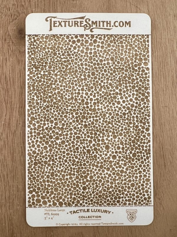 Textured card with circular pattern design.
