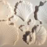 Shell-shaped silicone mold with multiple cavities.