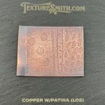 Textured copper sheet with patina design.