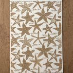 Starfish pattern on textured card background.