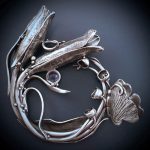 Elegant silver floral-themed decorative ornament.