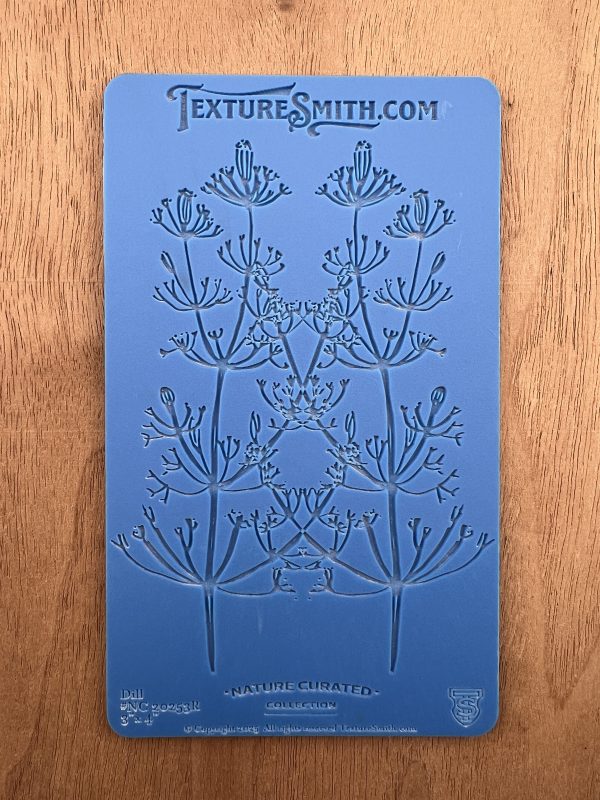 Blue floral texture mat on wooden surface.