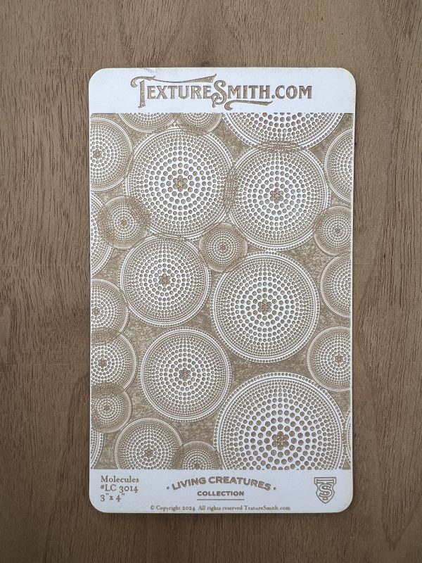 Textured card with circular dot patterns.