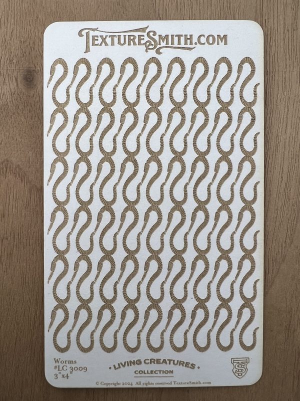 Textured worm pattern on rectangular card.