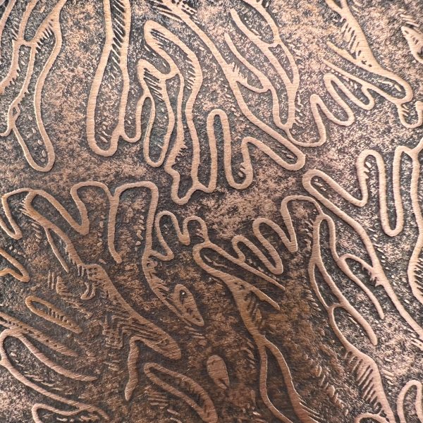 Brown abstract textured pattern on surface.
