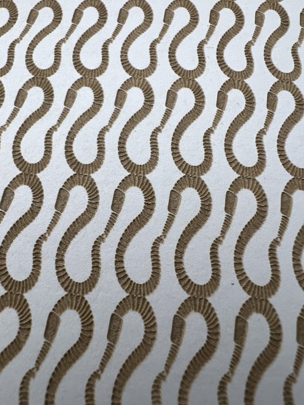 Brown serpentine pattern on white background.