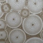 Circular geometric pattern with concentric dots.