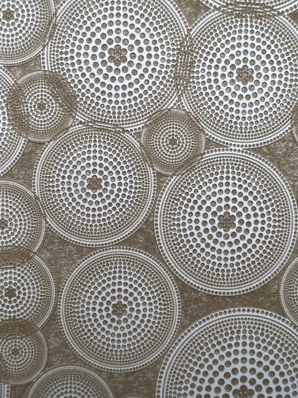 Circular geometric pattern with concentric dots.