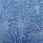 Blue abstract trees with intricate branch patterns.