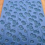 Blue leaf pattern texture mat on table.