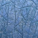 Frost patterns resembling pine branches on glass.