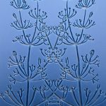 Embossed floral pattern on blue background.