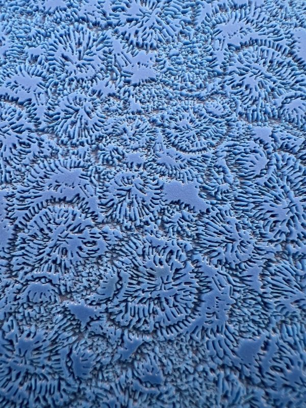 Blue textured pattern resembling abstract frost.