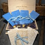 Wooden box with textured blue and white cards.