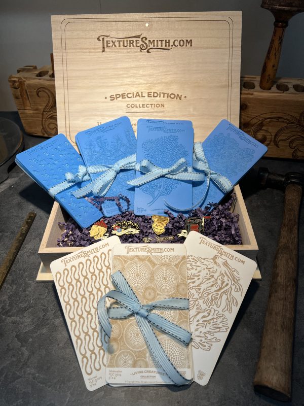 Wooden box with textured blue and white cards.