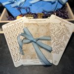 Textured cards with blue ribbon decoration.