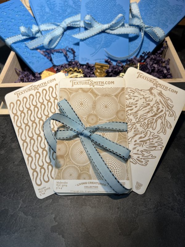 Textured cards with blue ribbon decoration.