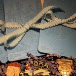 Embossing stencils with decorative pins and ribbon.