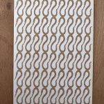 Textured board with worm pattern design.