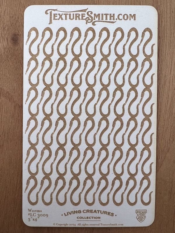 Textured board with worm pattern design.