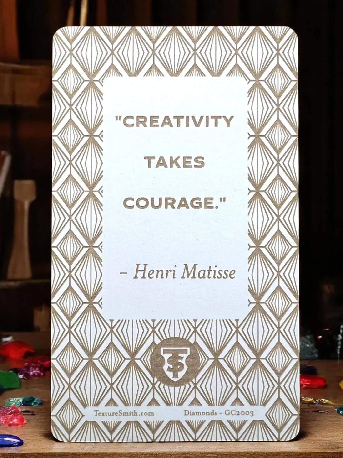 A decorative sign with a Henri Matisse quote on creativity and courage.