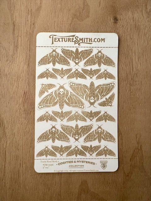 Card showing various moth species illustrations.