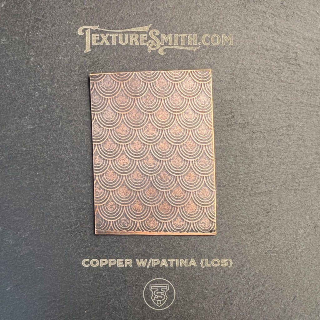 Copper metal sheet with patina and gloss texture.
